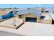 An aerial shot of a single-story home showcasing a desert front yard and an attached garage at 16010 N 64Th Dr, Glendale, AZ 85306