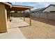 Expansive backyard with a covered patio area, perfect for outdoor entertaining and relaxation at 16010 N 64Th Dr, Glendale, AZ 85306