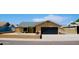 Charming single-story home featuring a two-car garage and low-maintenance desert landscaping at 16010 N 64Th Dr, Glendale, AZ 85306