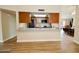 Open-concept kitchen featuring modern appliances and an eat-in bar at 16010 N 64Th Dr, Glendale, AZ 85306