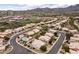 Inviting neighborhood with desert landscaping, single-Gathering homes, and community amenities including a football field and baseball fields at 16155 E Glenview Pl, Fountain Hills, AZ 85268
