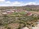 Well maintained football and track field with a view of the mountains and desert landscape on a sunny day at 16155 E Glenview Pl, Fountain Hills, AZ 85268