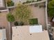 Aerial perspective of a serene backyard showcasing a gravel landscape, mature trees, and fenced in perimeter at 16155 E Glenview Pl, Fountain Hills, AZ 85268