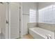Bathroom with tub and shower, block window and updated fixtures at 16155 E Glenview Pl, Fountain Hills, AZ 85268