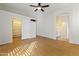 Bedroom with wood floors, closet and ensuite bathroom with double sinks at 16155 E Glenview Pl, Fountain Hills, AZ 85268