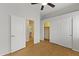 Neutral bedroom with wood floors, closet and laundry room access at 16155 E Glenview Pl, Fountain Hills, AZ 85268
