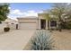 Charming single-story home featuring a desert landscape and a two-car garage at 16155 E Glenview Pl, Fountain Hills, AZ 85268