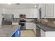Well-equipped kitchen with stainless steel appliances, granite countertops, and ample cabinetry at 16155 E Glenview Pl, Fountain Hills, AZ 85268