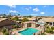 Community pool with ample lounge seating, tables, and mountain views on a bright, sunny day at 16155 E Glenview Pl, Fountain Hills, AZ 85268