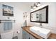 Bright bathroom featuring wood counters and white tile at 16857 E Deuce Ct, Fountain Hills, AZ 85268