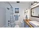 Updated bathroom with a tub, white tile, wooden vanity and modern fixtures at 16857 E Deuce Ct, Fountain Hills, AZ 85268