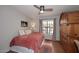 Bright bedroom features a ceiling fan and large window with patterned curtains at 16857 E Deuce Ct, Fountain Hills, AZ 85268