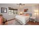 Cozy bedroom with a ceiling fan, neutral walls, and a bright window at 16857 E Deuce Ct, Fountain Hills, AZ 85268