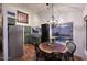 Charming dining area with Saltillo tile, views of the backyard pool, and open access to the kitchen at 16857 E Deuce Ct, Fountain Hills, AZ 85268
