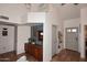 Bright foyer with high ceilings, terra cotta flooring, and stylish decor sets an inviting tone for the home at 16857 E Deuce Ct, Fountain Hills, AZ 85268