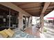 Comfortable covered patio with tile flooring offering a relaxing outdoor living space with lounge seating and garden views at 16857 E Deuce Ct, Fountain Hills, AZ 85268