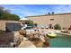 Outdoor living at its finest with a BBQ, patio seating, desert scape, and beautiful pool at 16857 E Deuce Ct, Fountain Hills, AZ 85268