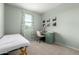 Bedroom with a desk, chair, and comfortable bed at 17454 W Red Fox Rd, Surprise, AZ 85387