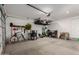 Spacious garage with organized storage solutions, including overhead racks and tool organizers at 17454 W Red Fox Rd, Surprise, AZ 85387