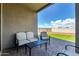 Comfortable patio area with cushioned seating, perfect for outdoor relaxation and entertainment at 17454 W Red Fox Rd, Surprise, AZ 85387