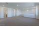 Large bonus room with neutral carpet, white walls and trim, recessed lights, and bright natural light at 21430 W Meadowbrook Ave, Buckeye, AZ 85396