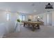 Spacious game room with a pool table, natural light, and neutral decor at 21430 W Meadowbrook Ave, Buckeye, AZ 85396