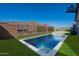 Virtually staged pool view in a backyard with mountain views and ample space for entertaining and relaxing at 21430 W Meadowbrook Ave, Buckeye, AZ 85396