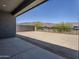 Spacious backyard with block wall and wrought iron fencing, ready for landscaping and outdoor enjoyment at 21450 W Meadowbrook Ave, Buckeye, AZ 85396