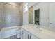 Well-lit bathroom with shower, bathtub, modern vanity, and sleek quartz countertop creating a luxurious spa-like experience at 21450 W Meadowbrook Ave, Buckeye, AZ 85396