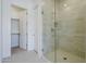 Bathroom featuring a tiled shower with glass enclosure at 21450 W Meadowbrook Ave, Buckeye, AZ 85396