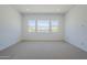 Bedroom featuring carpet, recessed lighting, and several windows providing an abundance of natural light at 21450 W Meadowbrook Ave, Buckeye, AZ 85396