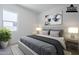Comfortable bedroom featuring neutral tones, a serene atmosphere, and a view of the outdoors at 21450 W Meadowbrook Ave, Buckeye, AZ 85396