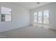Bright bedroom filled with natural light from the expansive windows offers a serene and relaxing atmosphere at 21450 W Meadowbrook Ave, Buckeye, AZ 85396