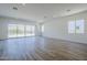 Bright open living area with sliding glass doors to patio and mountain views in the distance at 21450 W Meadowbrook Ave, Buckeye, AZ 85396