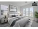 Cozy main bedroom with large windows, plush bedding, and stylish décor at 21450 W Meadowbrook Ave, Buckeye, AZ 85396