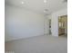 Spacious primary bedroom with carpet and access to the bathroom with double vanity at 21450 W Meadowbrook Ave, Buckeye, AZ 85396