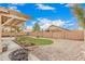 A well-maintained backyard with gravel, a grassy area, and a covered patio offering outdoor living at 22337 E Via Del Palo --, Queen Creek, AZ 85142