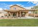 Backyard with lawn, patios and landscaped planters at 22337 E Via Del Palo --, Queen Creek, AZ 85142