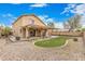 Spacious backyard with manicured lawn, gravel, covered patio and fire pit, perfect for entertaining at 22337 E Via Del Palo --, Queen Creek, AZ 85142