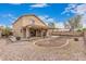 Large backyard with a covered patio, fire pit, and space for entertainment at 22337 E Via Del Palo --, Queen Creek, AZ 85142