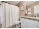 Bathroom with granite counters, white cabinets, shower-tub combo and decor at 22337 E Via Del Palo --, Queen Creek, AZ 85142