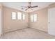 Empty bedroom featuring carpet flooring, and multiple windows at 22337 E Via Del Palo --, Queen Creek, AZ 85142