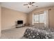 Inviting bedroom featuring a ceiling fan, a window with neutral paint and plush carpet at 22337 E Via Del Palo --, Queen Creek, AZ 85142