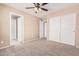 Empty bedroom featuring carpet flooring and double door closet at 22337 E Via Del Palo --, Queen Creek, AZ 85142