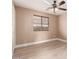 Neutral bedroom with wood-look floors, blinds, and a ceiling fan with lights at 22337 E Via Del Palo --, Queen Creek, AZ 85142