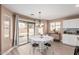 Cozy dining area with a round table and chairs, sliding glass door to the backyard at 22337 E Via Del Palo --, Queen Creek, AZ 85142