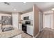 Bright kitchen featuring granite countertops, white cabinets and modern appliances at 22337 E Via Del Palo --, Queen Creek, AZ 85142