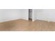 Bright bedroom featuring wood-look tile flooring and a closet for ample storage at 2823 W Eagle Talon Rd, Phoenix, AZ 85085