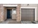 A well-maintained facade with a garage, front door, and brick accents at 2823 W Eagle Talon Rd, Phoenix, AZ 85085