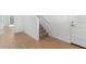 Hallway with wood-look flooring and stairway at 2823 W Eagle Talon Rd, Phoenix, AZ 85085